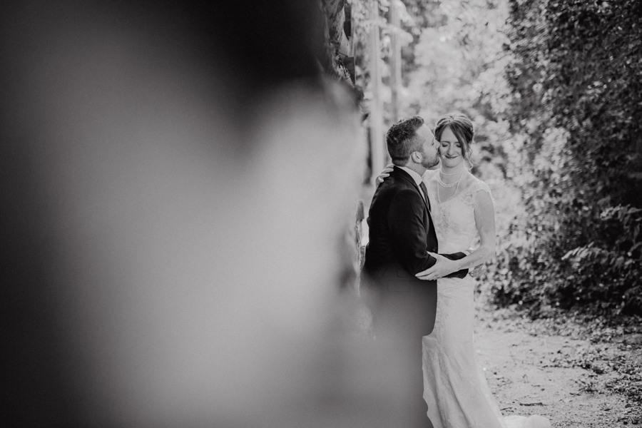 Bride and groom kiss at the nut farm, wedding in kelowna, kelowna bc, kelowna wedding photographer, amazing kelowna wedding, award winning kelowna photographers