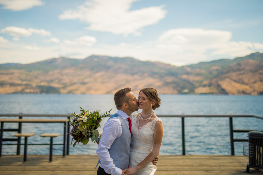 Bride and groom kiss at the nut farm, wedding in kelowna, kelowna bc, kelowna wedding photographer, amazing kelowna wedding, award winning kelowna photographers