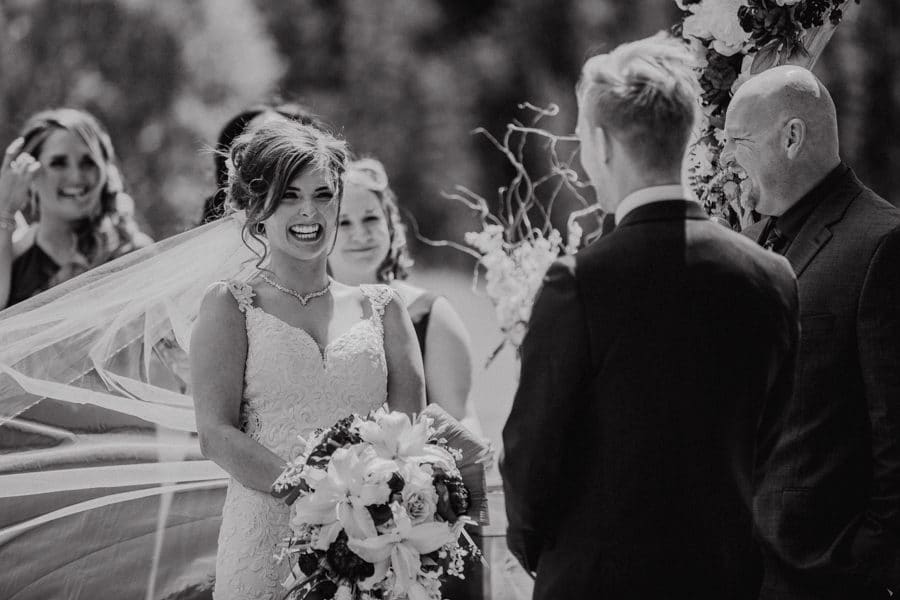 bride overwhelmed with laughter at the cochrane race house
