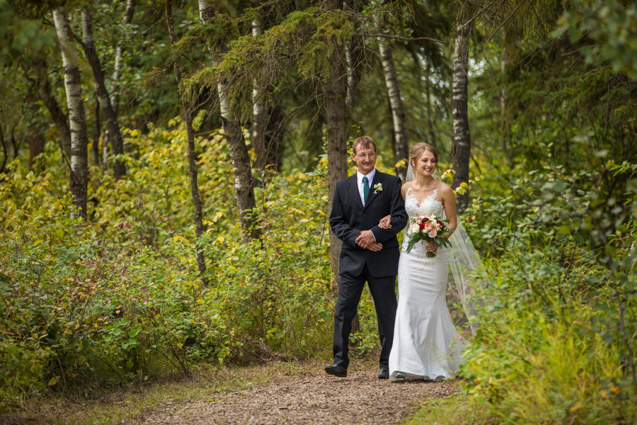 bride walking out in Nisku recreation centre