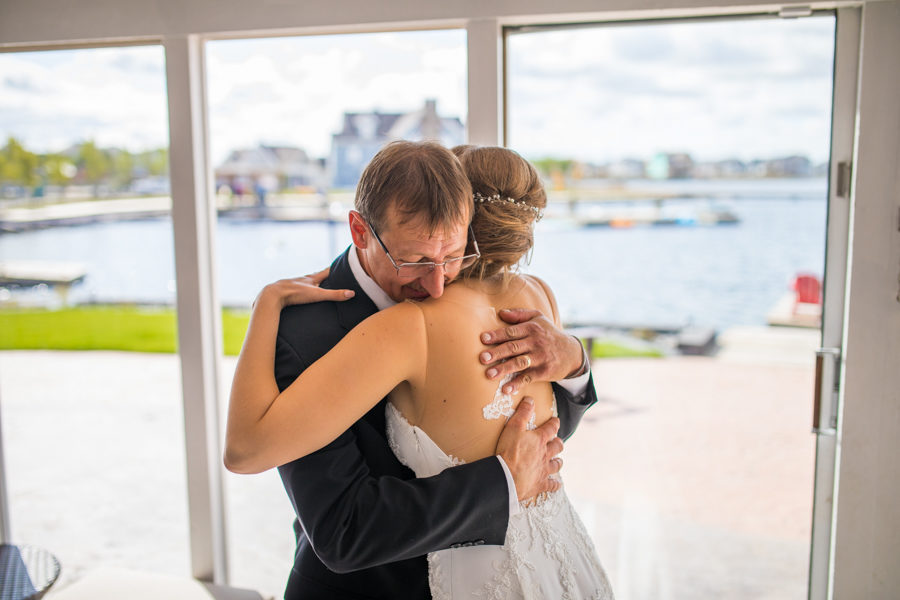 bride having a first look with her dad