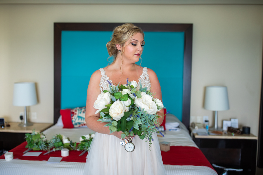 bride with flowers form the hotel