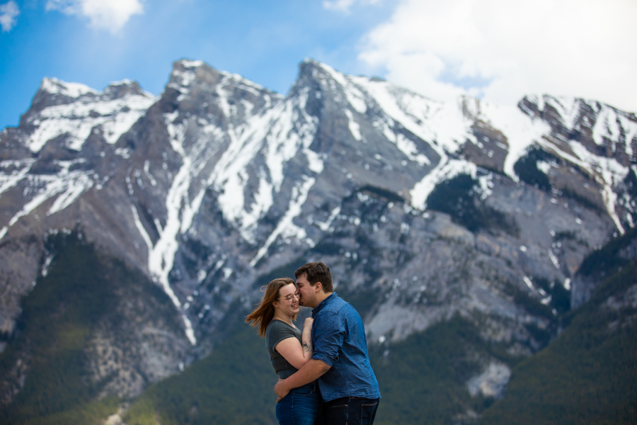 Lake Minnewanka couple kissing on the rock