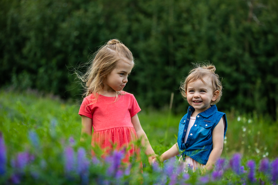 two girls standing in the park