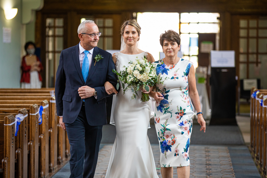 bride walking in with parents at St. Mary's Cathedral WEDDINGS