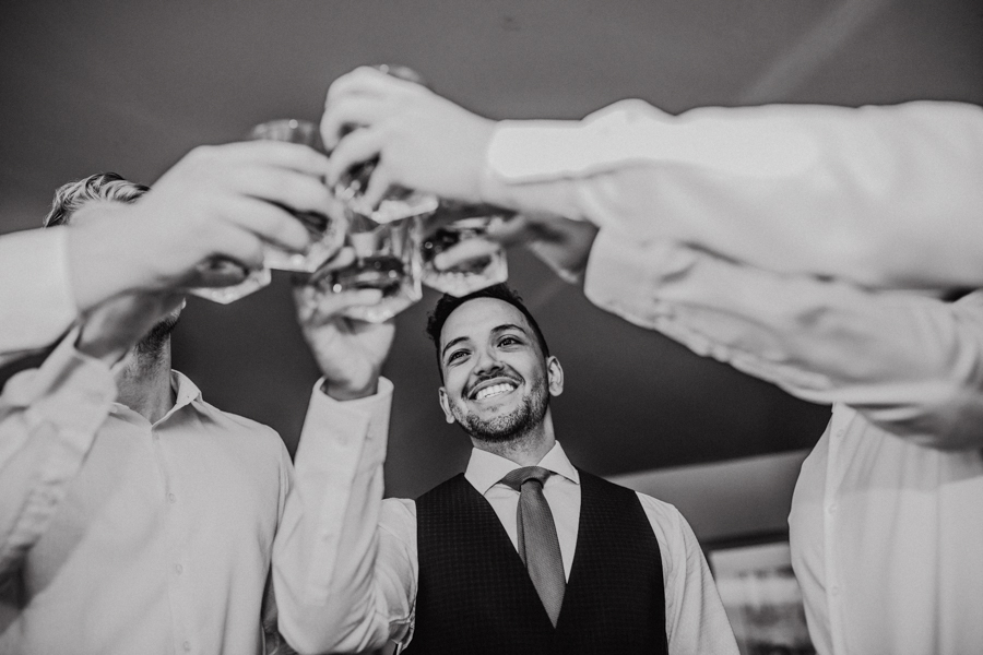 groom cheering wedding party