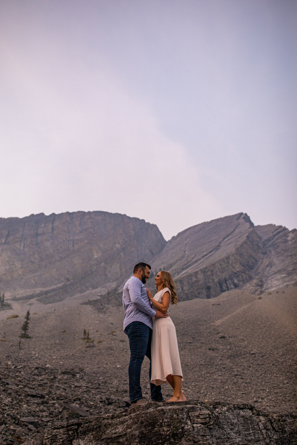 romantic couple posing in the mountains